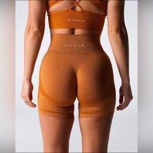 NVGTN Women's Seamless High-Waist Athletic Shorts in Rust Orange